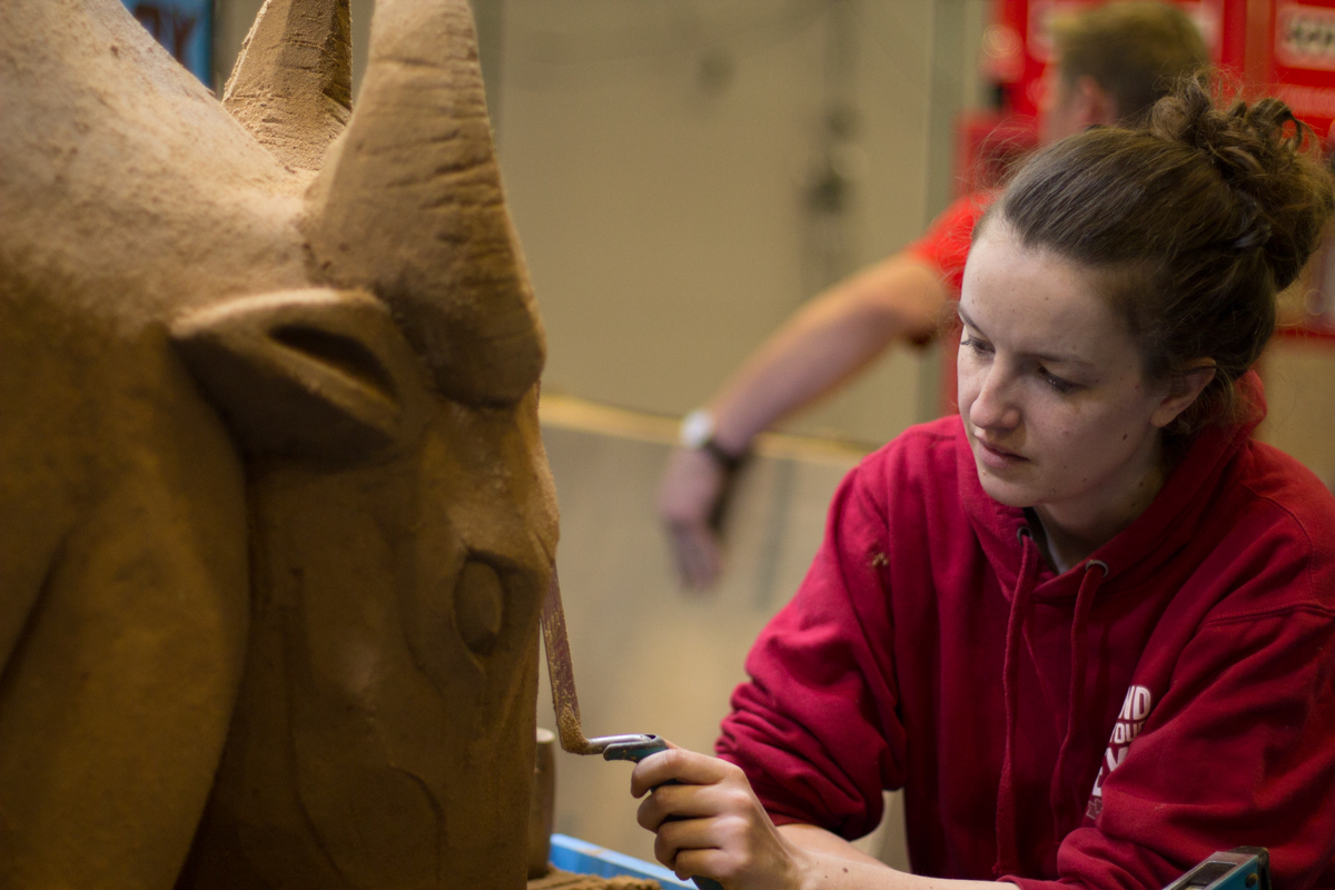 A Trade Show, sand sculpture, buckets and a van with Ox Tools.
