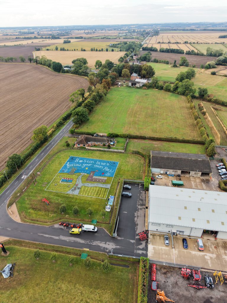 Children’s artwork brought to life into grass art for the Tour of Britain. 23 land_art_cycle_race